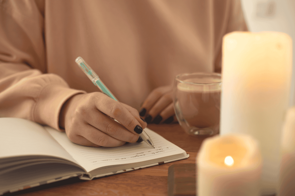 A calming scene featuring a person journaling by candlelight and coffee, fostering anxiety relief habits and building confidence daily.