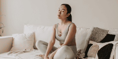 Peaceful self-care moment to cope with anxiety triggers through meditation and relaxation at home.