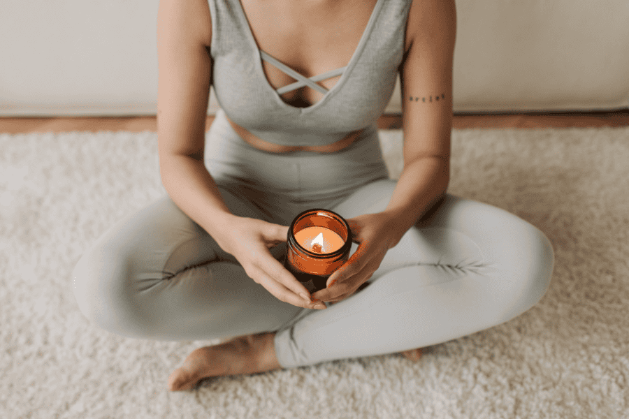 Mindfulness practice with candlelight for managing anxiety triggers and promoting emotional grounding.
