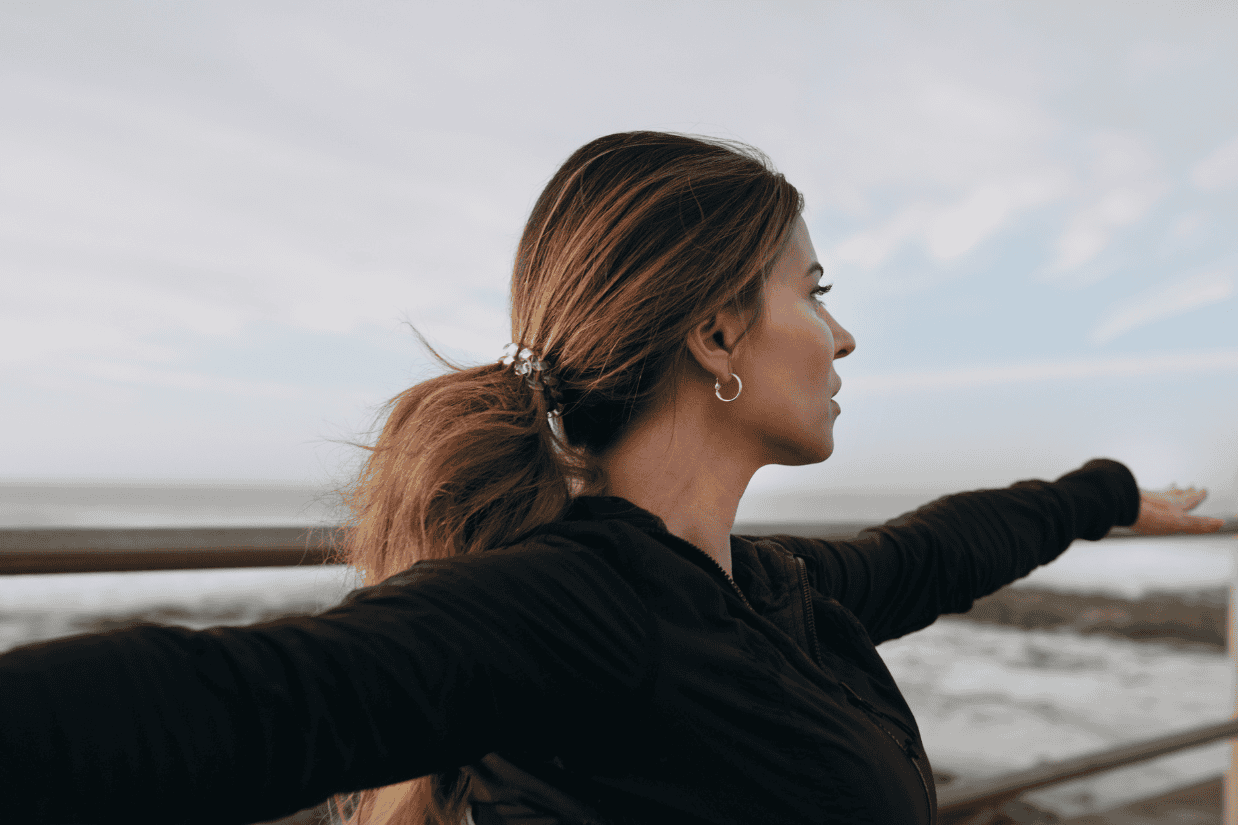 Person grounding through mindful movement near the ocean, symbolizing balance, presence, and healing—concepts explored in why coping skills stop working and how to rebuild emotional resilience.